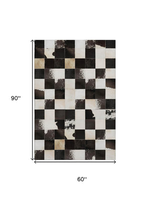 HomeRoots 5' X 8' Stylish Black Ivory Beige Patchwork Area Rug - Washable, UV-Protected, Pet-Friendly Design 644738