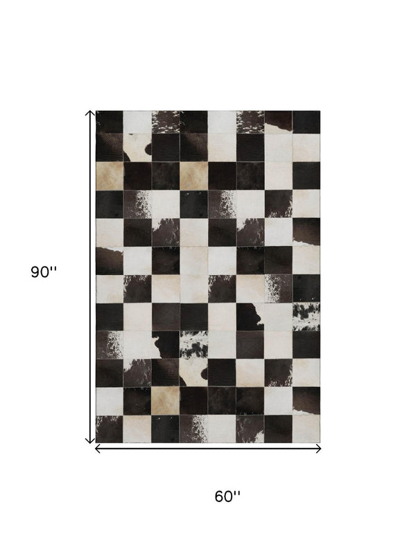 HomeRoots 5' X 8' Stylish Black Ivory Beige Patchwork Area Rug - Washable, UV-Protected, Pet-Friendly Design 644738