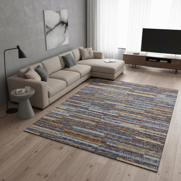 HomeRoots 9' X 12' Abstract Area Rug in Blue, Gold & Brown - Washable, UV Protected, Perfect for Family Spaces 644927