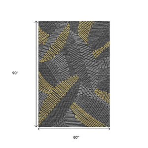 HomeRoots 5' X 8' Gray Gold and Black Botanical Leaves Rug - Washable, UV Protected, Stylish & Durable Decor 645008