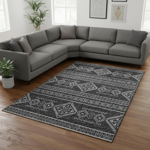 HomeRoots 9' X 12' Gray and Ivory Tribal Area Rug - Washable, UV-Protected, Durable for High-Traffic Spaces 645084