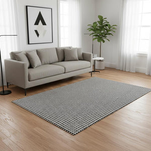 HomeRoots 5' X 8' Black And White Houndstooth Area Rug - Washable, UV Protected, Perfect for High-Traffic Spaces 645171