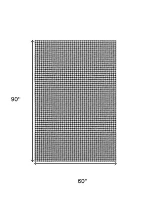 HomeRoots 5' X 8' Black And White Houndstooth Area Rug - Washable, UV Protected, Perfect for High-Traffic Spaces 645171