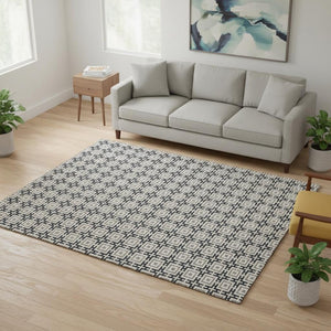 HomeRoots 5' X 8' Black and Ivory Geometric Area Rug - Washable, UV Protected, Durable for High Traffic Homes 645255