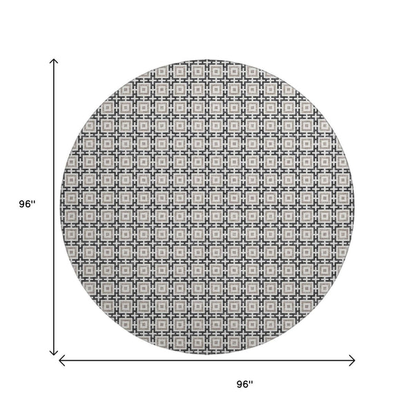 HomeRoots 8' Black and Ivory Geometric Round Rug - Washable, UV Protected, Kid & Pet Friendly for Stylish Spaces 645256