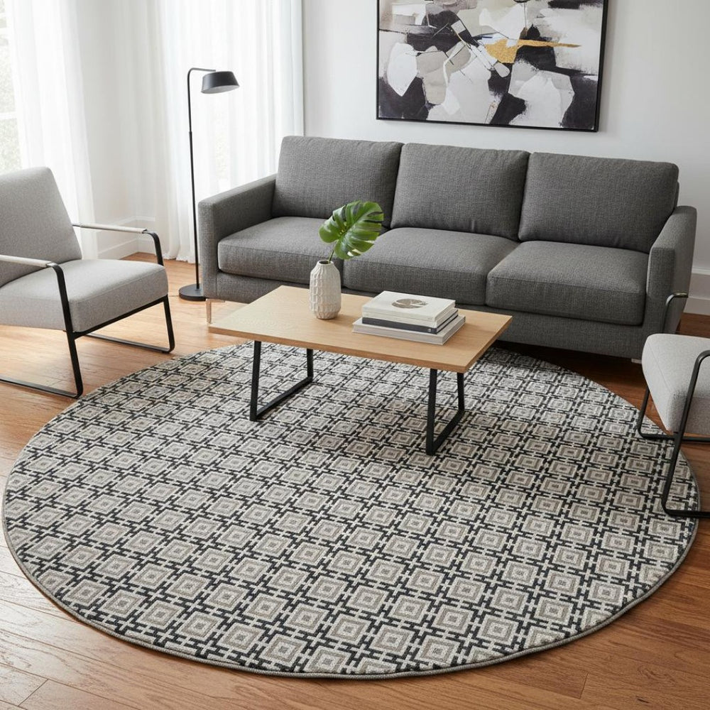 HomeRoots 8' Black and Ivory Geometric Round Rug - Washable, UV Protected, Kid & Pet Friendly for Stylish Spaces 645256