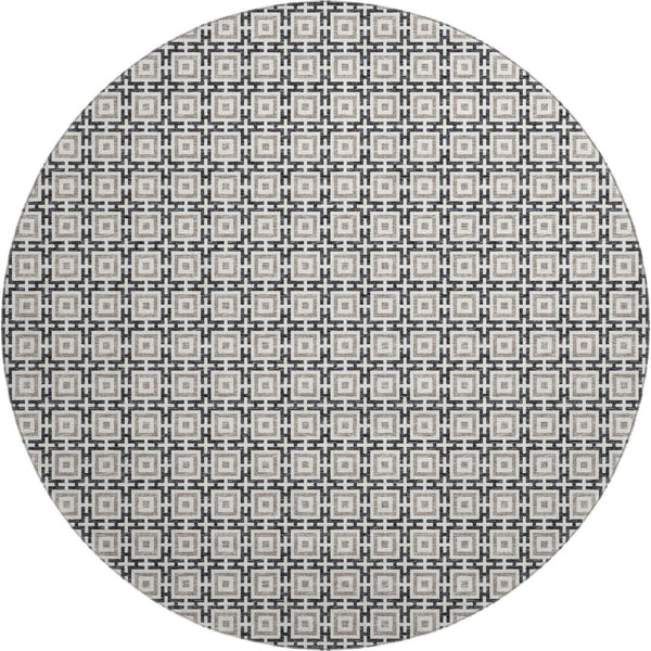 HomeRoots 8' Black and Ivory Geometric Round Rug - Washable, UV Protected, Kid & Pet Friendly for Stylish Spaces 645256
