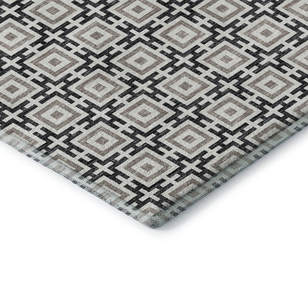 HomeRoots 8' Black and Ivory Geometric Round Rug - Washable, UV Protected, Kid & Pet Friendly for Stylish Spaces 645256