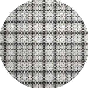 HomeRoots 8' Black and Ivory Geometric Round Rug - Washable, UV Protected, Kid & Pet Friendly for Stylish Spaces 645256