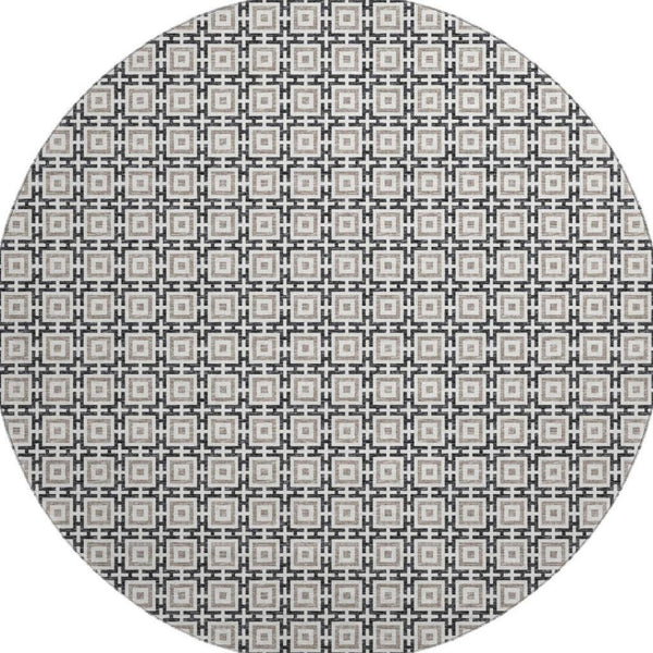 HomeRoots 8' Black and Ivory Geometric Round Rug - Washable, UV Protected, Kid & Pet Friendly for Stylish Spaces 645256