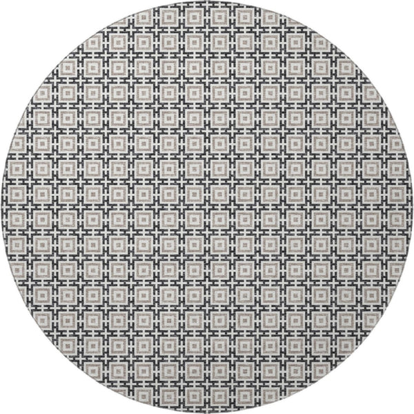 HomeRoots 8' Black and Ivory Geometric Round Rug - Washable, UV Protected, Kid & Pet Friendly for Stylish Spaces 645256