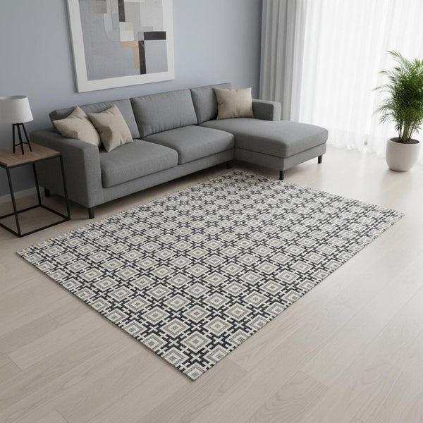 HomeRoots 10' X 14' Black and Ivory Geometric Area Rug - Washable, UV Protected, Perfect for Busy Homes! 645259