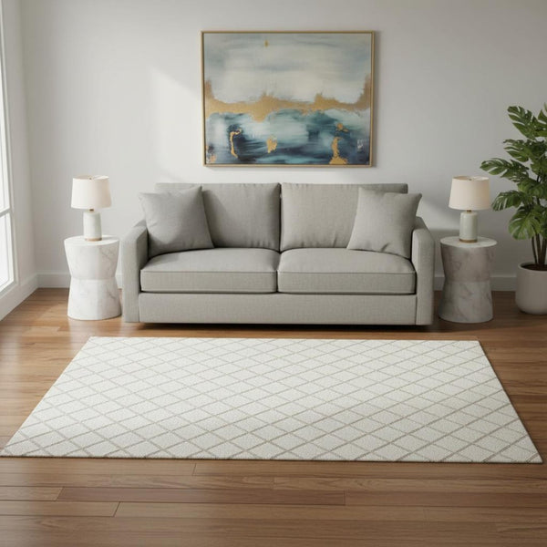 HomeRoots 5' X 8' Ivory and Taupe Geometric Area Rug - Washable, UV Protected, Stain Resistant for Modern Spaces 645279