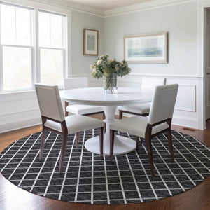 HomeRoots 8' Black and Ivory Geometric Round Rug - Washable, UV-Protected, Durable Design for Busy Homes 645322