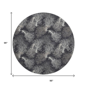 HomeRoots 8' Midnight and White Geometric Round Rug - Washable, UV Protected, Stylish for High-Traffic Areas 645759