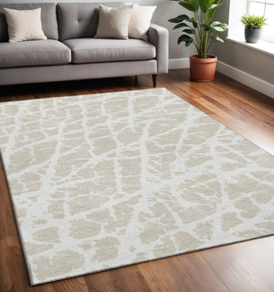HomeRoots 5' X 8' Beige and Ivory Abstract Area Rug - Washable, UV Protected, Ideal for Homes with Kids & Pets 646514