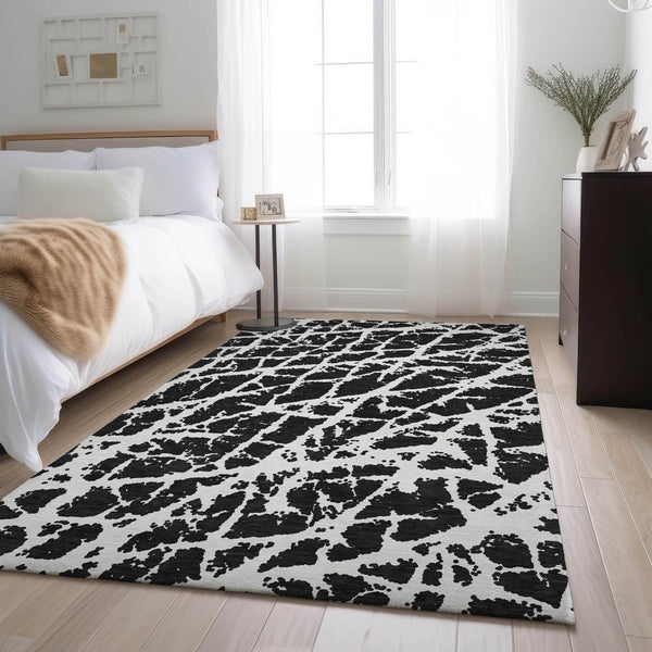HomeRoots 5' X 8' Black And Ivory Abstract Area Rug - Washable, UV Protected, Stylish & Durable for Families 646520