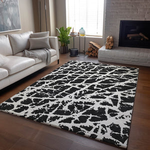 HomeRoots 5' X 8' Black And Ivory Abstract Area Rug - Washable, UV Protected, Stylish & Durable for Families 646520