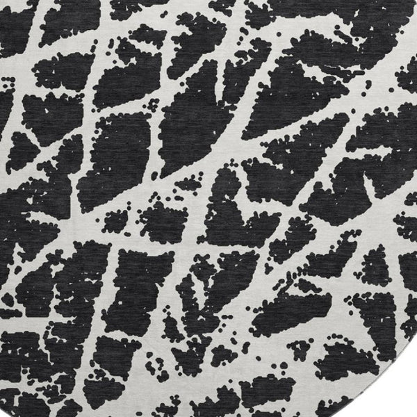 HomeRoots 8' Black And Ivory Abstract Washable Round Rug - Stylish, Durable & UV-Protected for Busy Homes! 646521
