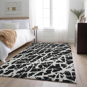 HomeRoots 8' X 10' Modern Black and Ivory Abstract Washable Area Rug with UV Protection for High-Traffic Homes 646522