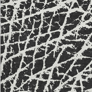 HomeRoots 8' X 10' Modern Black and Ivory Abstract Washable Area Rug with UV Protection for High-Traffic Homes 646522