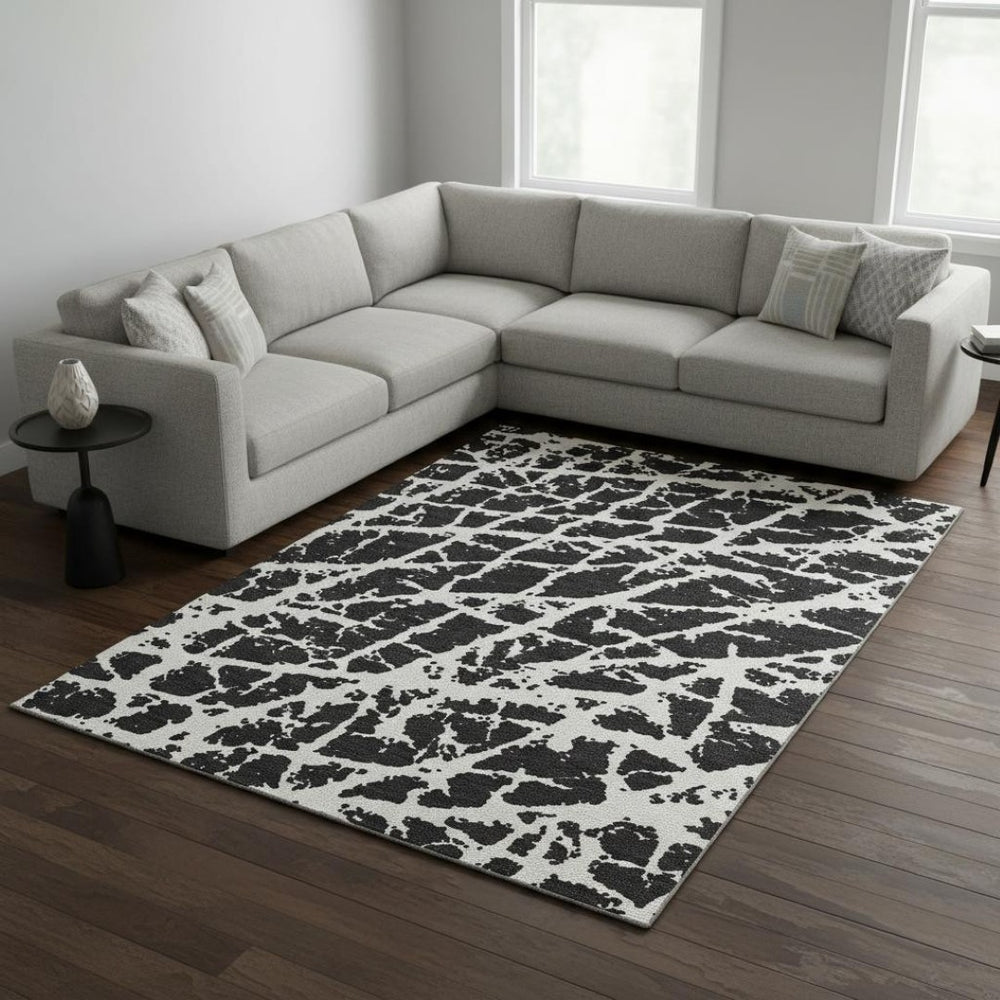 HomeRoots 9' X 12' Black And Ivory Abstract Washable Area Rug – Stylish, Durable, Stain-Resistant with UV Protection 646523