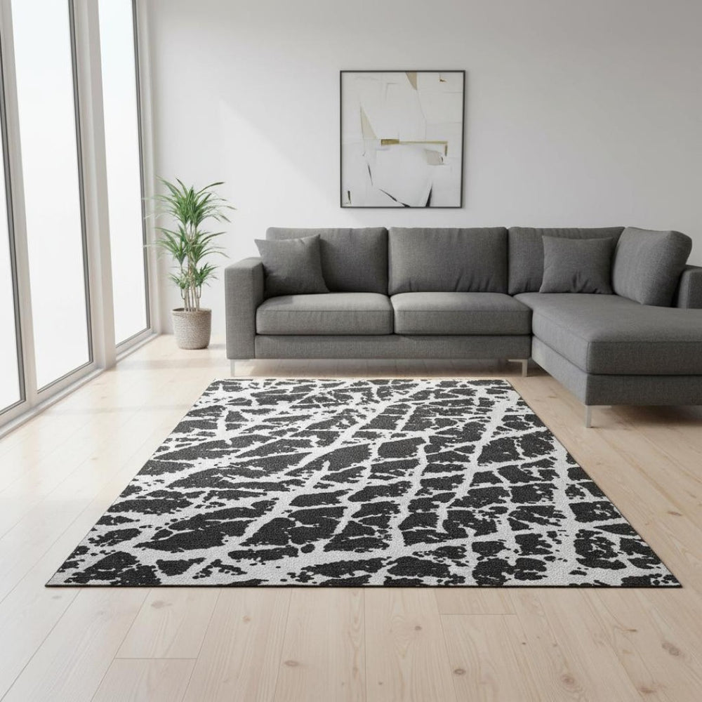 HomeRoots 10' X 14' Black And Ivory Abstract Area Rug – Washable, UV-Protected, Durable & Stylish for Homes 646524
