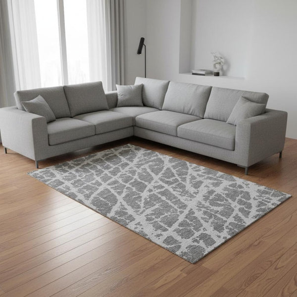 HomeRoots 10' X 14' Charcoal & Ivory Abstract Washable Area Rug with UV Protection for Stylish Living Spaces 646536