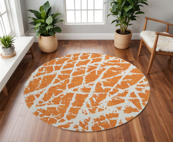 HomeRoots 8' Eye-Catching Orange and Ivory Abstract Washable Round Rug with UV Protection for Durable Living 646563