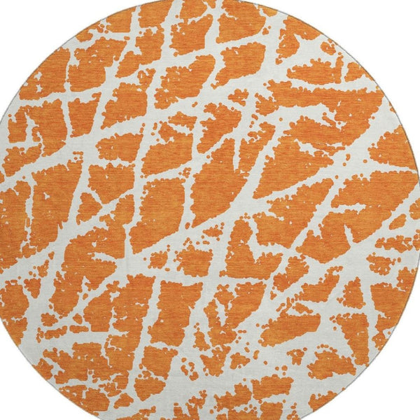 HomeRoots 8' Eye-Catching Orange and Ivory Abstract Washable Round Rug with UV Protection for Durable Living 646563
