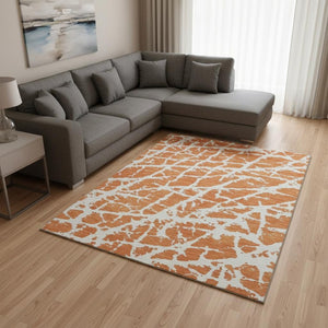 HomeRoots 9' X 12' Modern Orange and Ivory Abstract Area Rug – Washable, UV Protected, Stain Resistant Design 646565