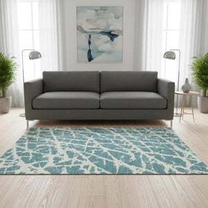 HomeRoots 5' X 8' Teal and Ivory Abstract Area Rug – Durable, Washable, UV-Protective for Modern Spaces 646592