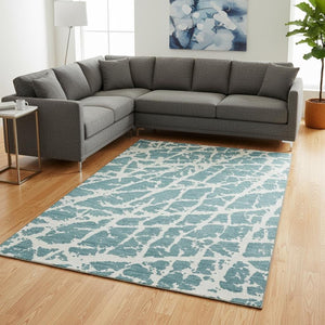 HomeRoots 8' X 10' Teal And Ivory Abstract Area Rug – Washable, UV-Protected, Durable Comfort for Busy Homes 646594