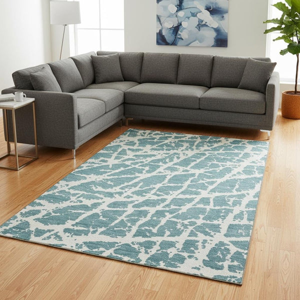 HomeRoots 8' X 10' Teal And Ivory Abstract Area Rug – Washable, UV-Protected, Durable Comfort for Busy Homes 646594