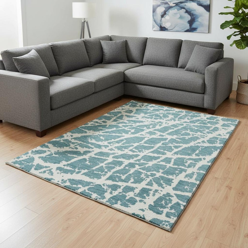 HomeRoots 10' Teal and Ivory Abstract Area Rug – Durable, Washable, UV Protected for Modern Homes with Pets! 646596