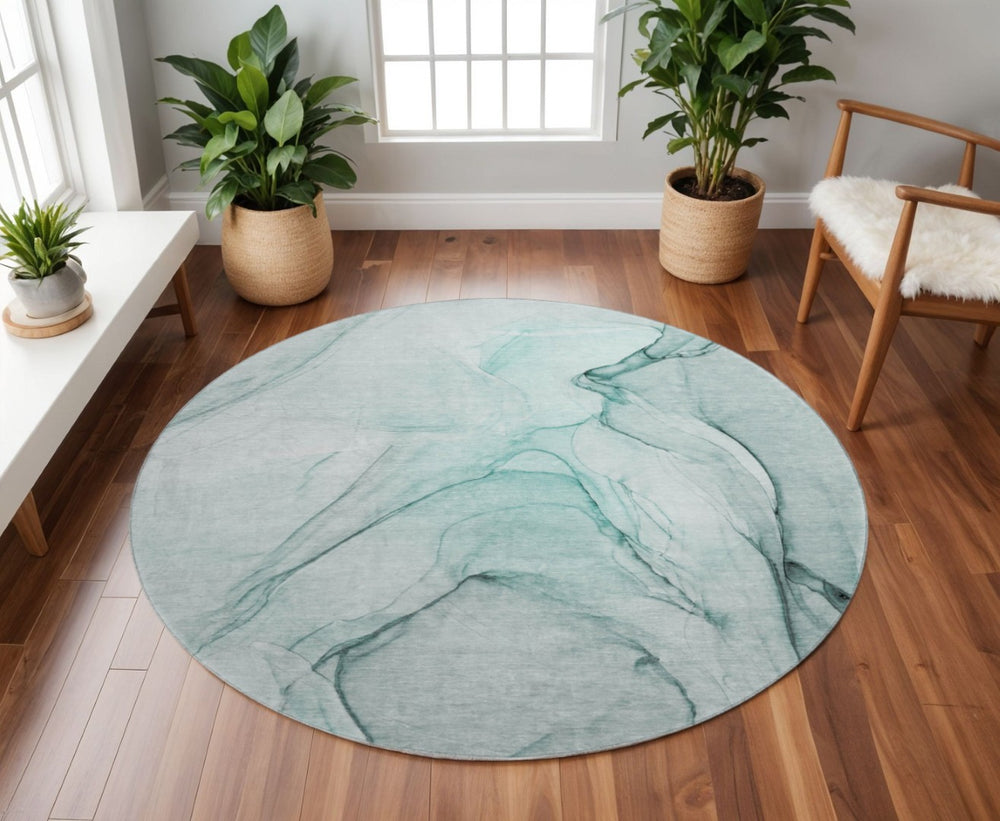 HomeRoots 8' Teal and Ivory Abstract Round Rug - Washable, UV Protected, and Perfect for Busy Homes! 646653