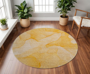 HomeRoots 8' Abstract Orange and Ivory Washable Round Rug with UV Protection for Durable, Low-Maintenance Style 646945