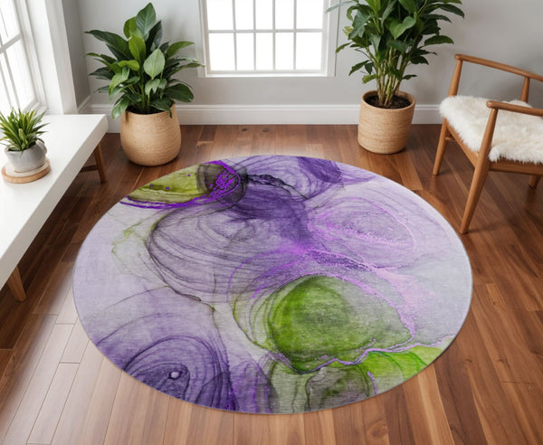 HomeRoots 8' Vibrant Purple, Green & Ivory Abstract Round Rug - Washable, UV Protected, Stain Resistant Design 647047