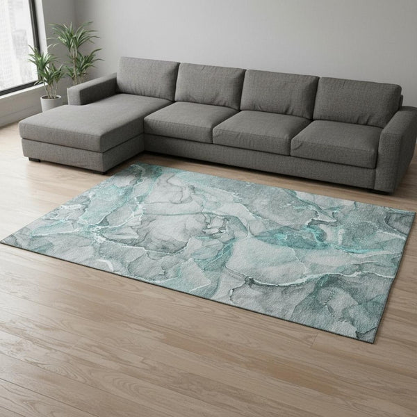 HomeRoots 9' X 12' Teal and Ivory Abstract Area Rug - Washable, UV Protected, Durable for High-Traffic Spaces 647283