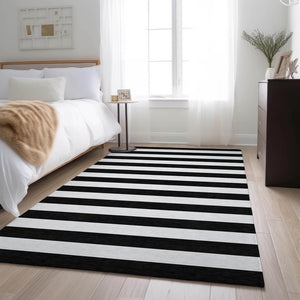 HomeRoots 8' X 10' Black And Ivory Striped Area Rug - Durable, Washable, UV-Protected for High-Traffic Spaces 647564