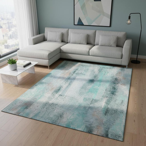 HomeRoots 10' Teal and Ivory Abstract Area Rug - Washable, UV Protection, Stain Resistant for High-Traffic Homes 648148