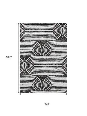 HomeRoots 5' X 8' Stylish Black And Ivory Geometric Area Rug - Washable, UV-Protected, Ideal For Homes 648222