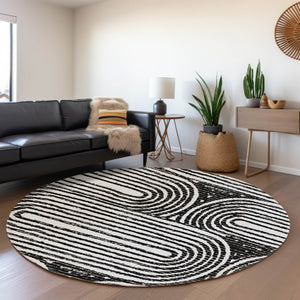 HomeRoots 8' Black And Ivory Geometric Round Rug - Washable, UV-Protected, Modern Design for High-Traffic Areas 648223