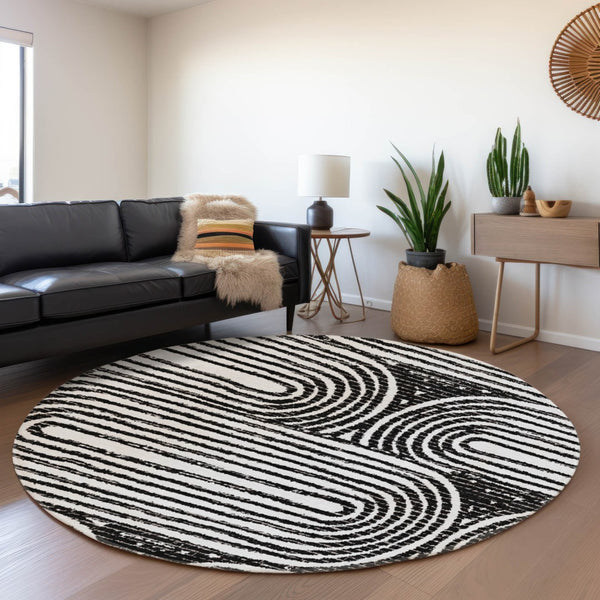 HomeRoots 8' Black And Ivory Geometric Round Rug - Washable, UV-Protected, Modern Design for High-Traffic Areas 648223