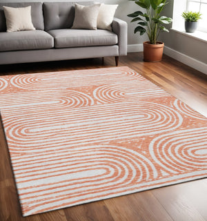 HomeRoots 5' X 8' Salmon and Ivory Geometric Area Rug - Washable, Stain Resistant, UV Protected for Busy Homes 648258