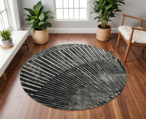 HomeRoots 8' Black And Ivory Geometric Round Rug - Stylish, Washable, UV-Protected, Perfect for Modern Spaces 648319