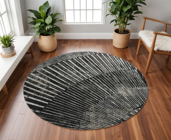 HomeRoots 8' Black And Ivory Geometric Round Rug - Stylish, Washable, UV-Protected, Perfect for Modern Spaces 648319