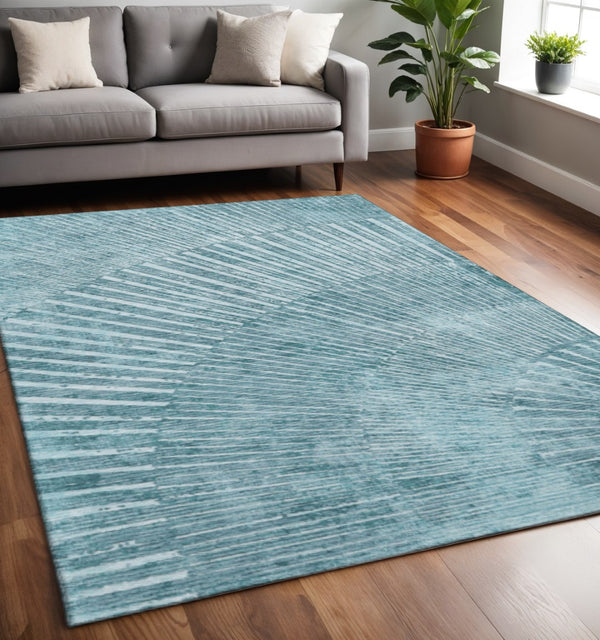 HomeRoots 5' X 8' Teal and Ivory Geometric Area Rug – Durable, Stain Resistant, UV Protected, Easy Care Design 648354