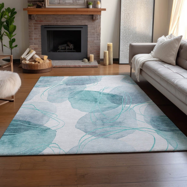 HomeRoots 5' X 8' Teal and Ivory Abstract Area Rug - Washable, UV-Protected, Durable Comfort for Busy Homes 648438