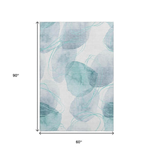 HomeRoots 5' X 8' Teal and Ivory Abstract Area Rug - Washable, UV-Protected, Durable Comfort for Busy Homes 648438